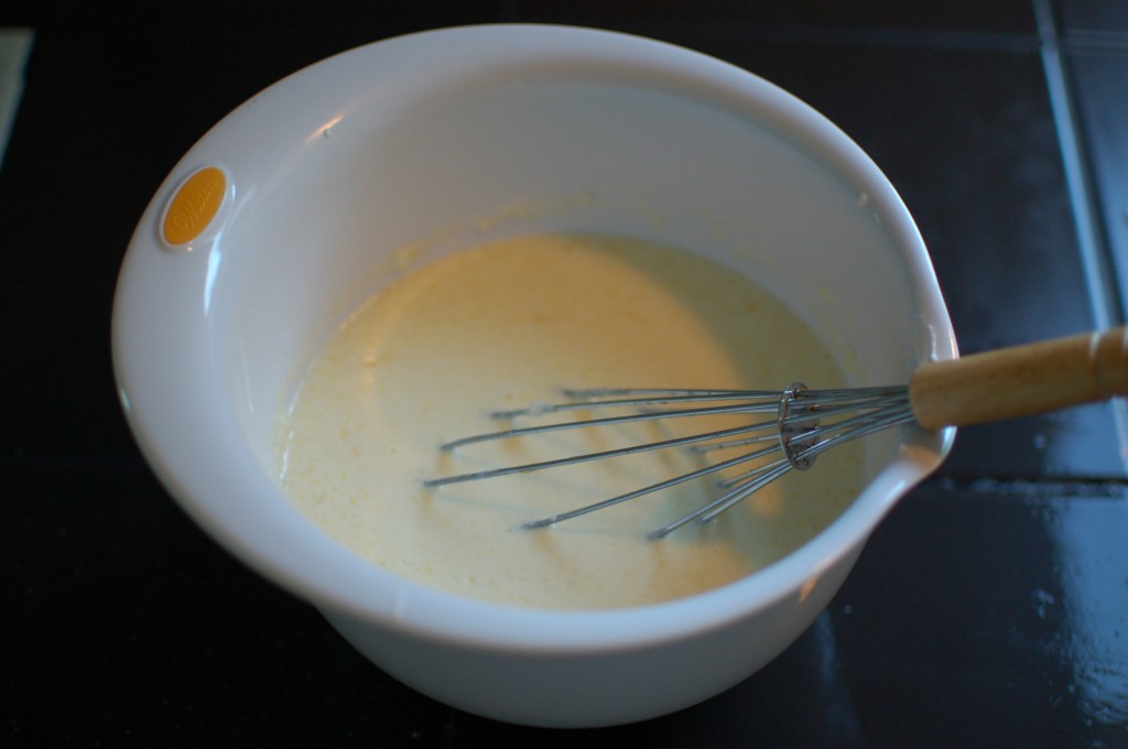 Whisking together cheese bread wet ingredients