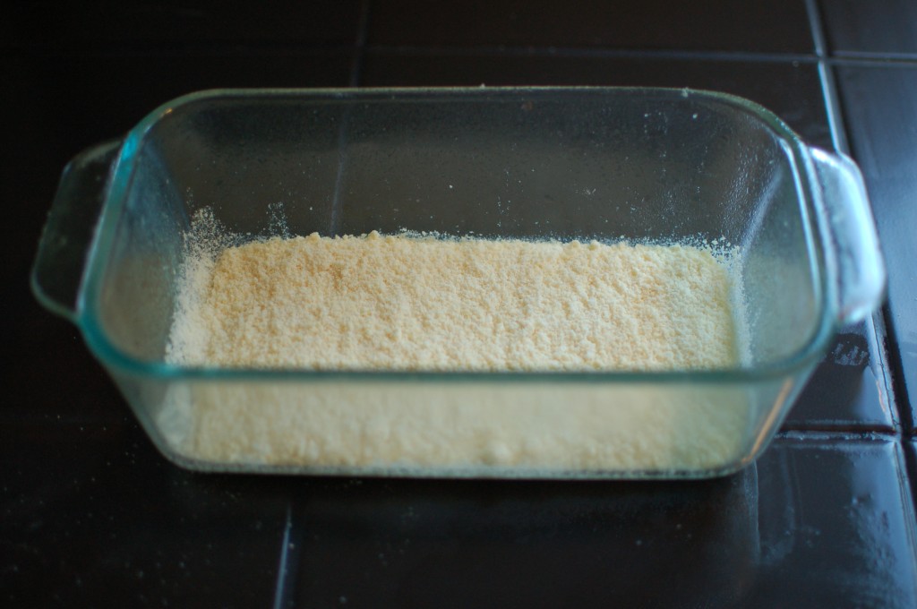 Parmesan cheese sprinkled in the loaf pan