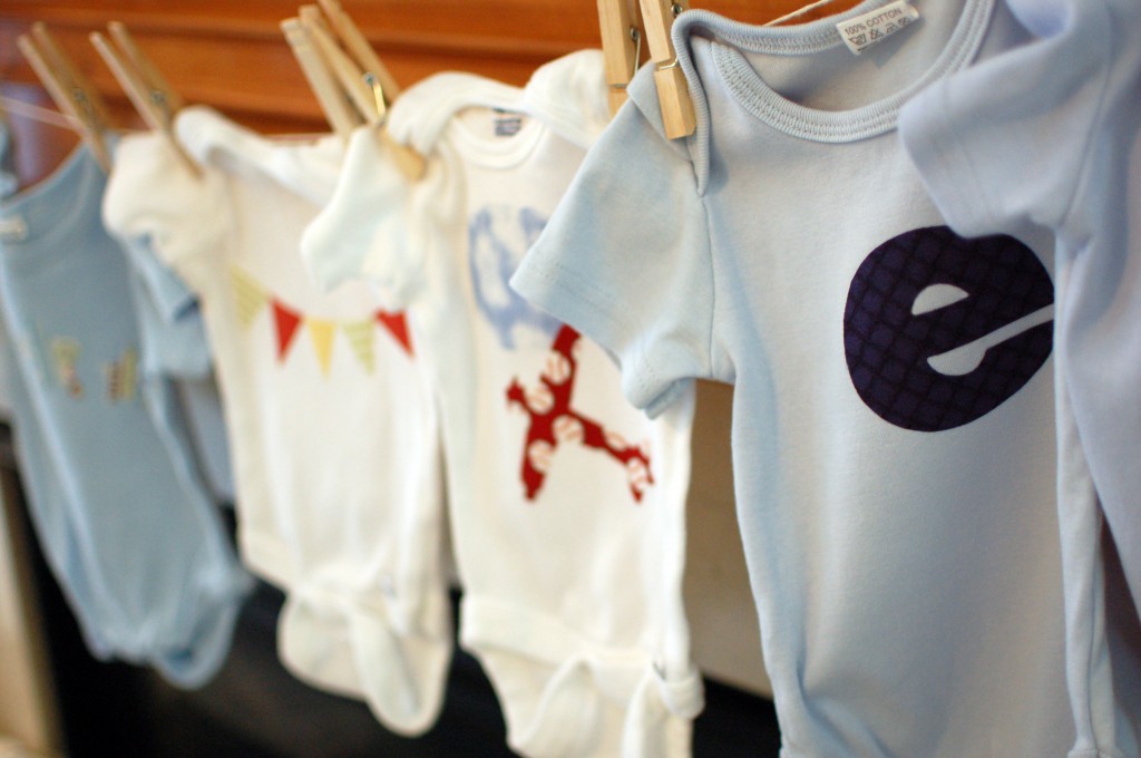 Row of decorated onesies