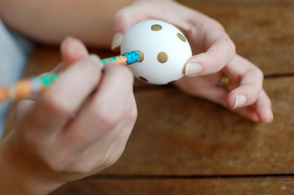 Painting dots on Easter eggs