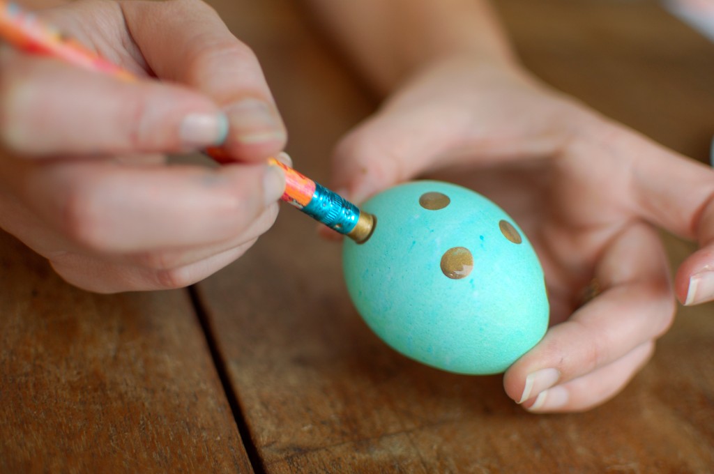 Painting dots on Easter eggs