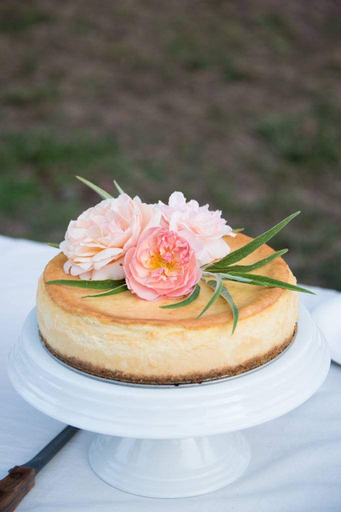 Cheesecake with floral decorations and jam filling