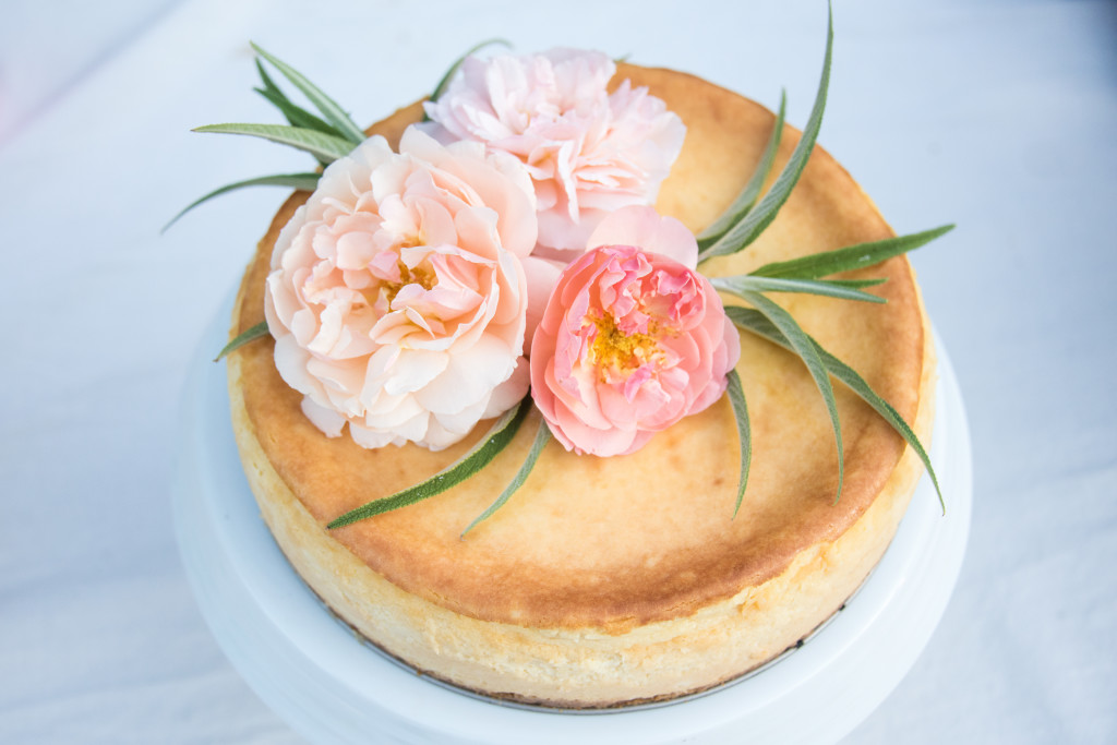 Cheesecake with floral decorations and jam filling